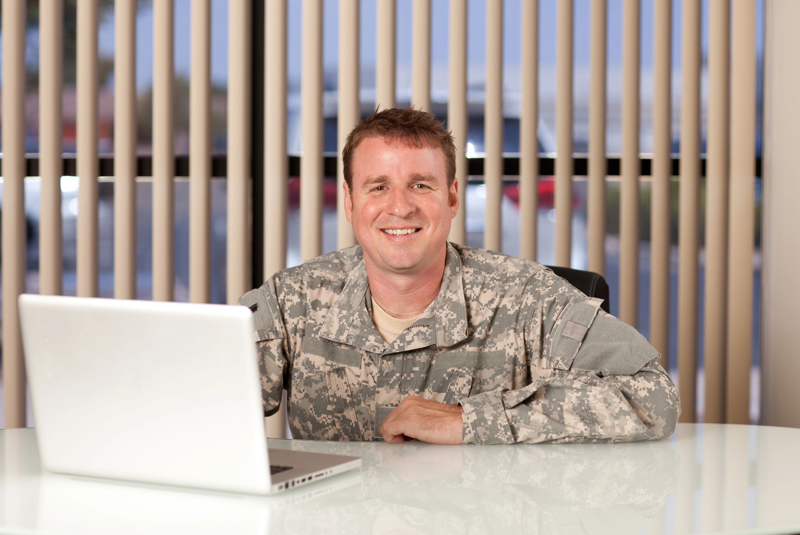Military service member at laptop